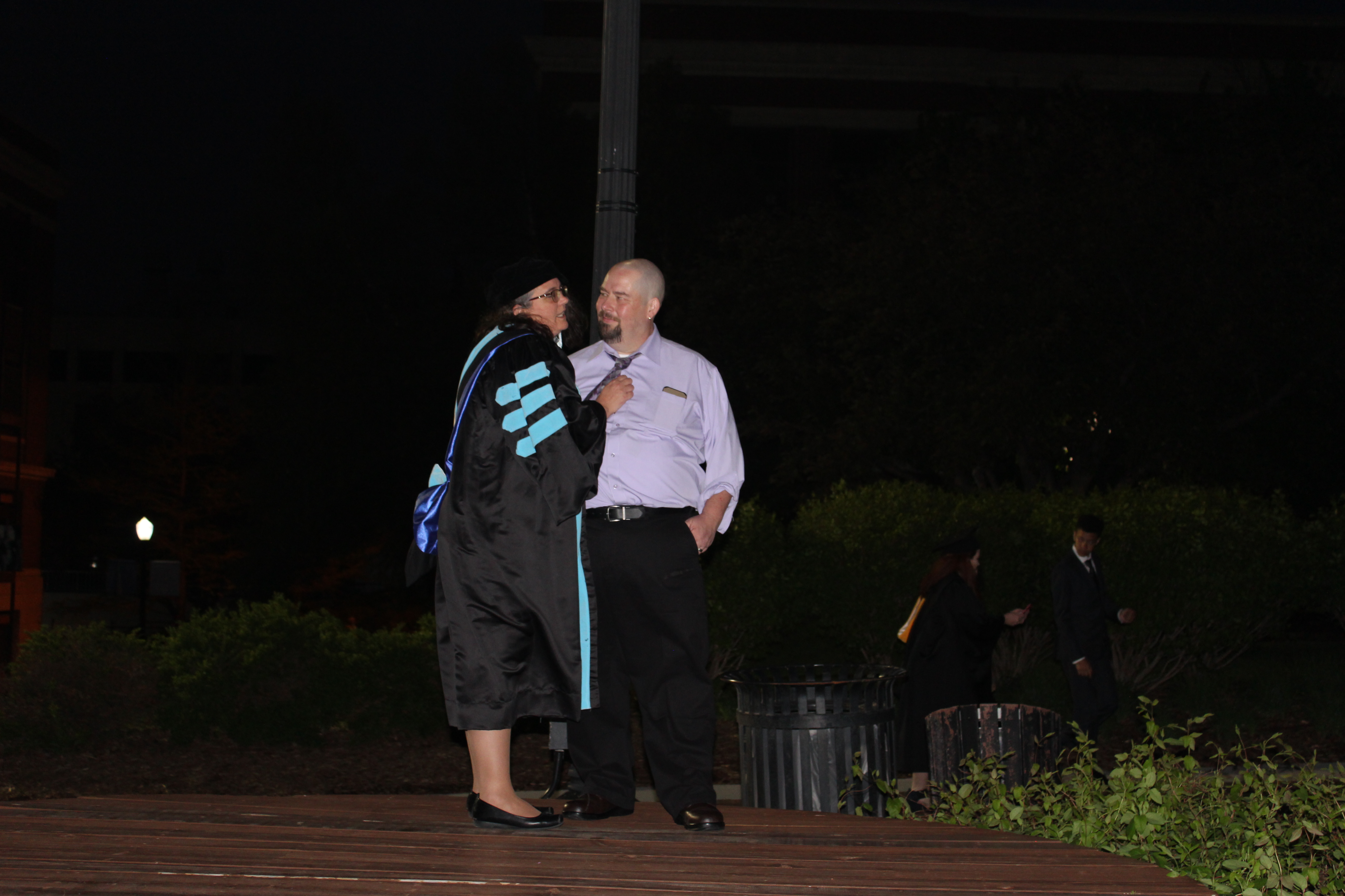 Larina Warnock and husband Mark at doctorate graduation
